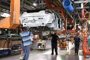 Assembly line workers assemble Chevy Volt electric vehicles and Opel Amperas at the General Motors Detroit Hamtramck Assembly Plant in Michigan. (Bill Pugliano/Getty Images)