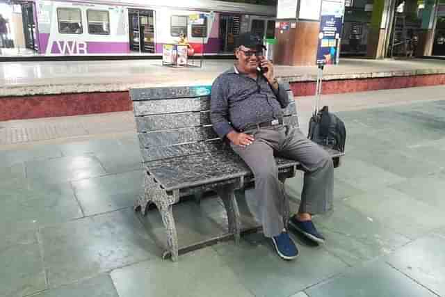 A passenger at a railway station.