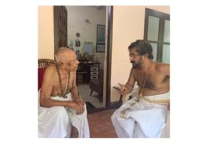 Dr CP Mathew  Retd. Head of the Oncology Department, Kottayam Medical College (left) conversing with Brahmashree Suryan Subramanian Bhattathiri (right).