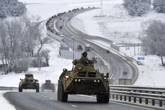 A convoy of Russian armoured weapons moves along the highway in Crimea
