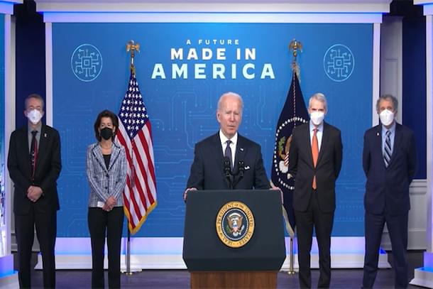 President Joe Biden stands with Patrick Gelsinger, CEO of Intel