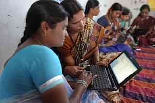 Villagers from Bibinagar using computers in the outskirts of Hyderabad. Photo credit: NOAH 
SEELAM/AFP/GettyImages