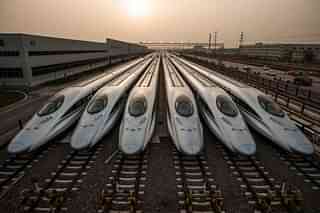High speed trains parked at a depot.