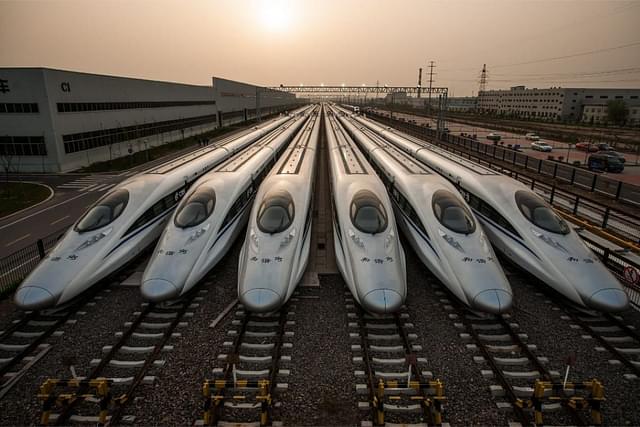 High-speed trains parked at a depot.