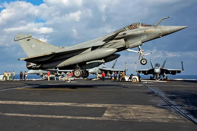 French Rafale-M on US aircraft carrier Dwight D Eisenhower with F/A-18 fighters in the background. 