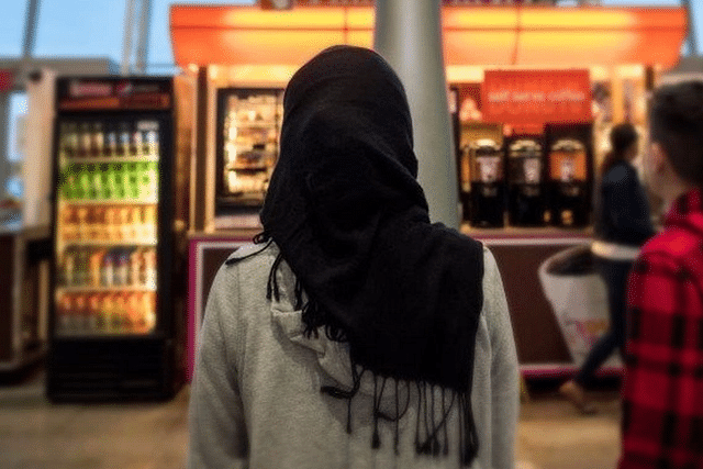 Representative image: a young woman wearing a hijab watches on (Representative image) (Drew Angerer/Getty Images) 