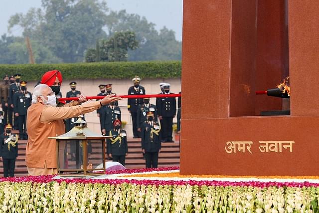Prime Minister Narendra Modi lighting the flame at the National War Memorial.