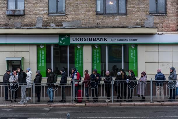 People queuing outside an ATM in Kyiv | Credits: New York Times