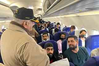 Minister of state for civil aviation General VK Singh interacting with Indians rescued under Operation Ganga (@Gen_VKSingh/Twitter)