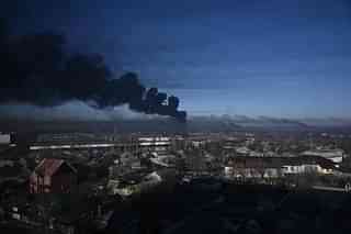 Smoke billows from military airport near Kharkiv in Ukraine. 