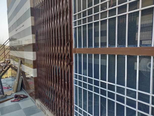 The iron sliding gate.