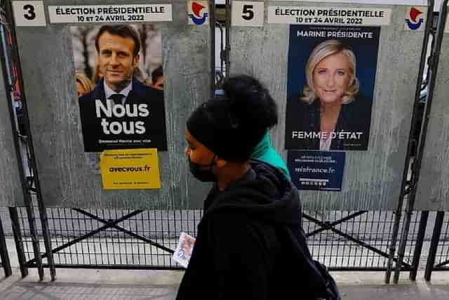 Posters of French President Emmanuel Macron and challenger Marine Le Pen.