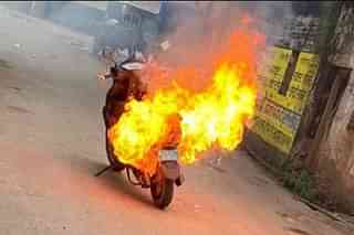 An electric scooter on fire.