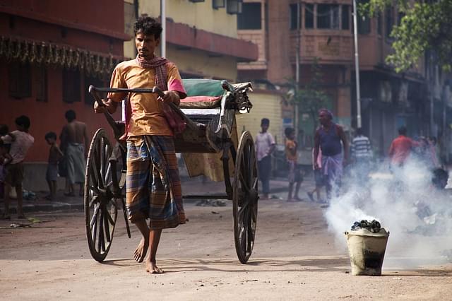 A rickshaw-puller in Kolkata (Wikimedia Commons) 