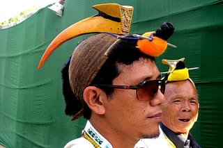 A Nishi traditional head-dress having a hornbill beak. (Wikimedia Commons)