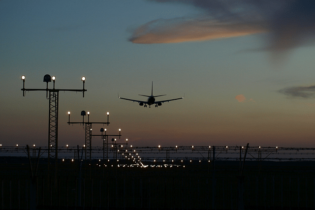 A plane on approach to the runway for landing