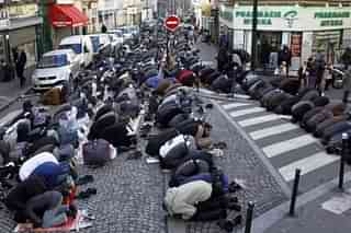 Muslims pray in a Paris street.