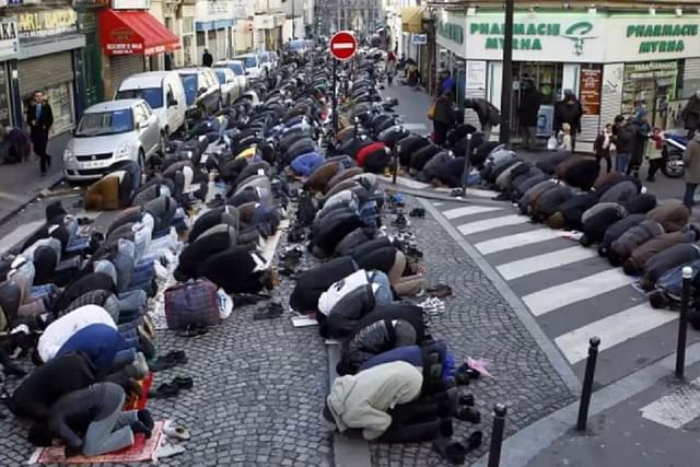 Muslims pray in a Paris street.