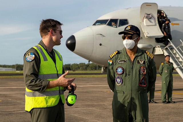 Indian and Australian officers with a P-8 in the background. (Twitter)