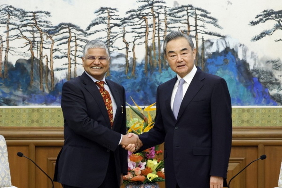 Chinese Foreign Minister Wang Yi meets mew Indian ambassador to China Pradeep Kumar Rawat. 
