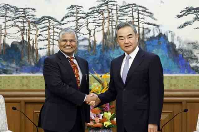 Chinese Foreign Minister Wang Yi meets mew Indian ambassador to China Pradeep Kumar Rawat. 
