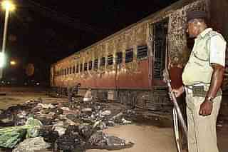 The remains of the Sabarmati Express that was set ablaze. (SEBASTIAN D’SOUZA/AFP/Getty Images)