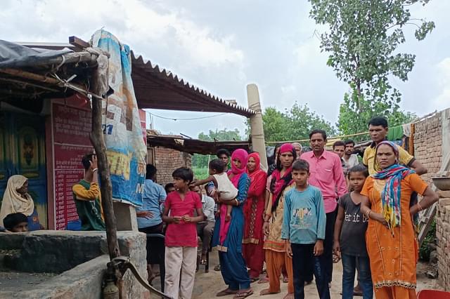 Family and neighbours of Baburam at his house