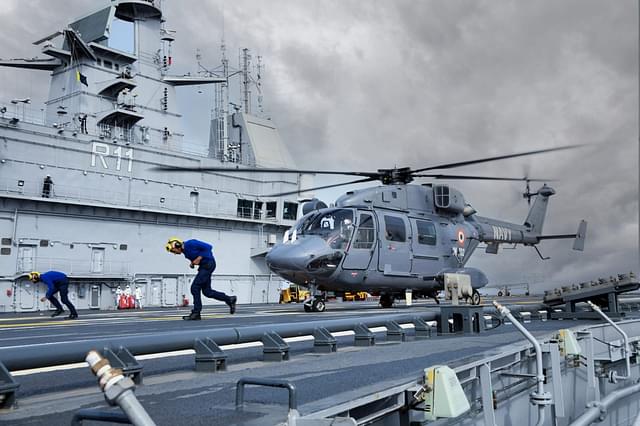 A Dhruv helicopter landing on IAC Vikrant's deck. (Indian Navy)