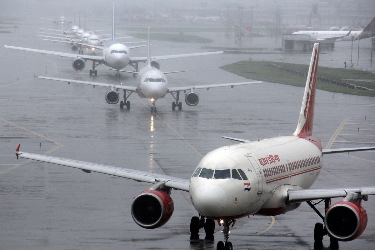 Planes queue up on the taxiway for take-off at Chhatrapati Shivaji International Airport in Mumbai, Maharashtra. (via Getty Images)