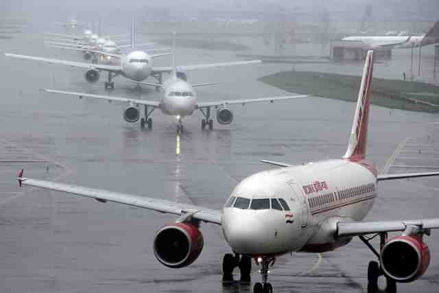 Planes queue up on the taxiway for take-off during rains at Chhatrapati Shivaji International Airport in Mumbai, Maharashtra (Pramod Thakur/Hindustan Times via Getty Images)