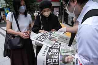 Shocked Japanese citizens try to come to terms with the news of the assassination of Abe.