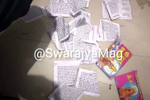 Torn pages of 'Durga Saptsati' book.
