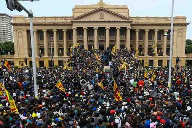 Sri Lankan protesters at the Presidential Palace. (Picture: @LANKATIME1)