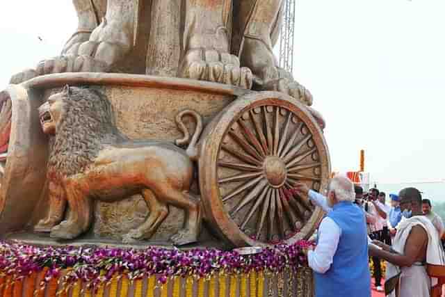 Prime Minister Narendra Modi unveiling the National Emblem cast on the New Parliament Building (PIB)