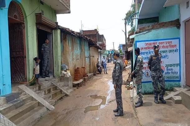 A picture of the police guarding the woman’s house last week