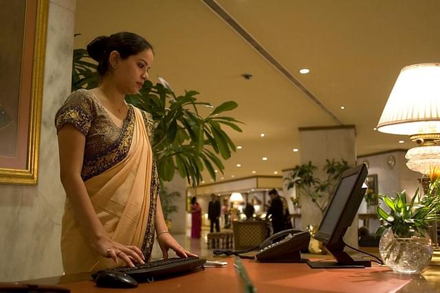 A Front Desk Officer at the Taj Palace Hotel.

©ILO/Benoit Marquet