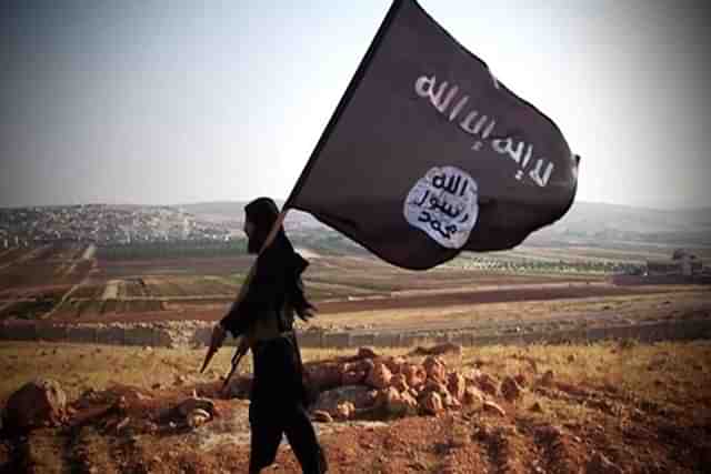 Representative image of an ISIS fighter with the group’s flag (Representative Image)