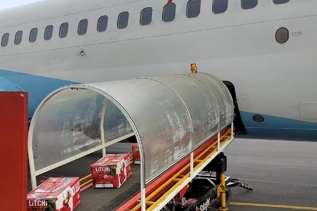 Fresh litchis being loaded on a flight to Mumbai from Darbhanga Airport (@HardeepSPuri/X)