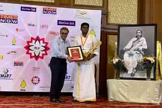 K Annamalai receives the Dr S P Mukherjee Award for Politics at the Pondy Lit Fest.