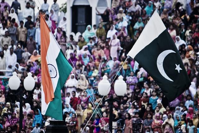 The flags of India and Pakistan are lowered simultaneously at the Attari border (Jack Zalium/Flickr) 