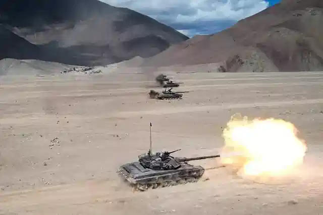 Indian Army tanks fire during an exercise in Ladakh.