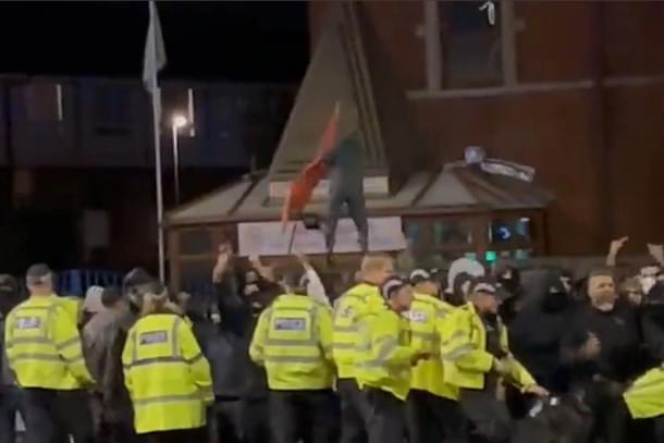 A still from a video of saffron flag being pulled down.