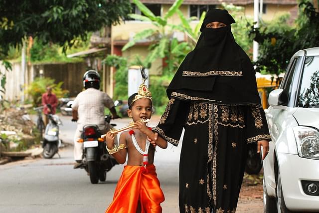 Muslim woman with her son dressed as Krishna (Rajtilak Naik/Flickr)
