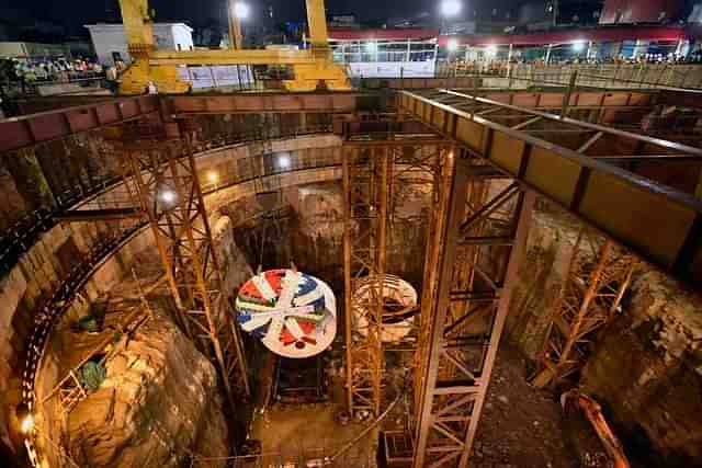 A tunnel boring machine (TBM) being lowered down a shaft. (Kunal Patil/Hindustan Times via Getty Images)