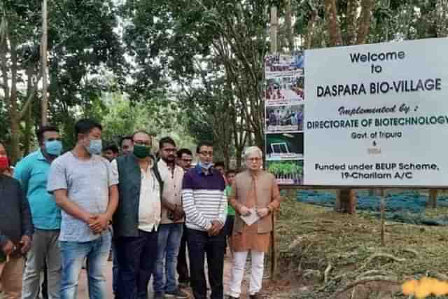 Tripura Deputy Chief Minister Jishnu Deb Burman, right, at the entrance of a bio-village.