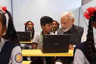 PM Modi interacts with school students during the launch of 'Mission School of Excellence' at Gandhinagar, Gujarat