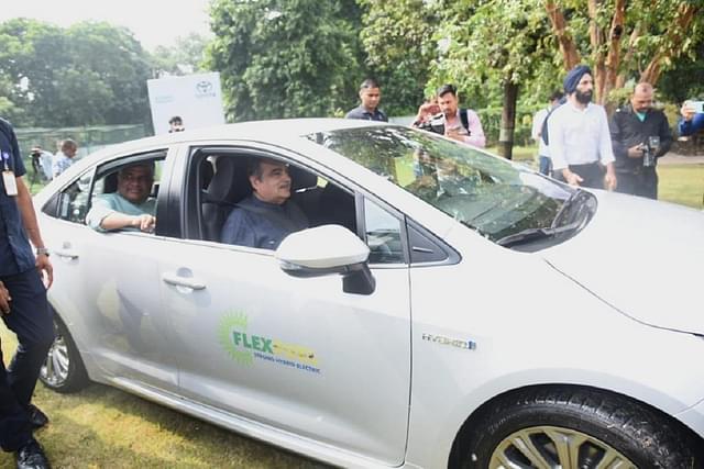 Nitin Gadkari behind the wheel of Corolla Altis FFV-SHEV. 