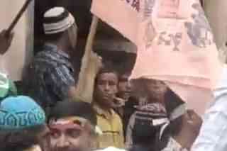 A still from the video showing the sloganeering.