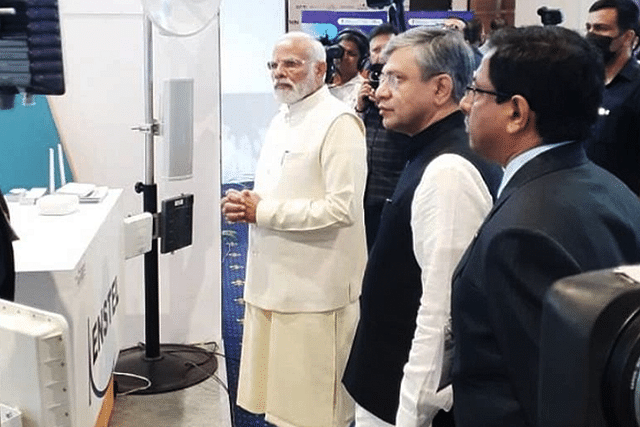 Prime Minister Modi and IT Minister Ashwini Vaishnaw are briefed on LiFi at  the Nav Wireless Technologies stand  during India Mobile Congress, 1 October 2022.