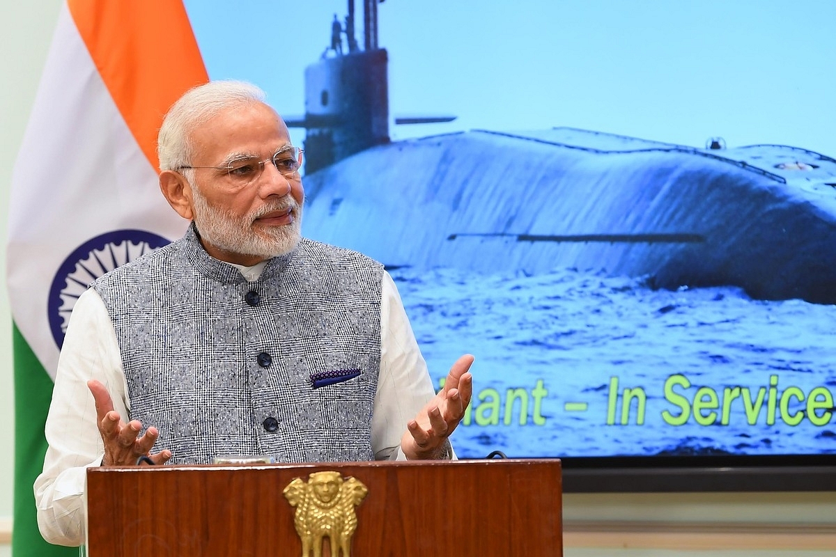 Prime Minister Narendra Modi speaking at an event with an image of INS Arihant, its clearest pictures, in the background. (@narendramodi/Twitter)